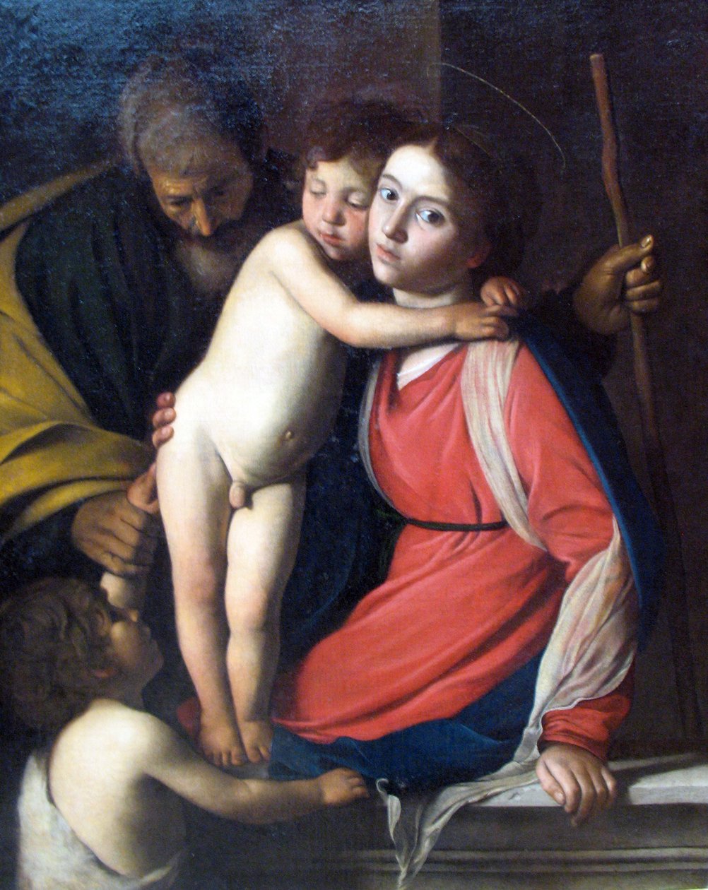 A Szent Család a csecsemővel Keresztelő Szent János alkotó: Michelangelo Merisi Caravaggio