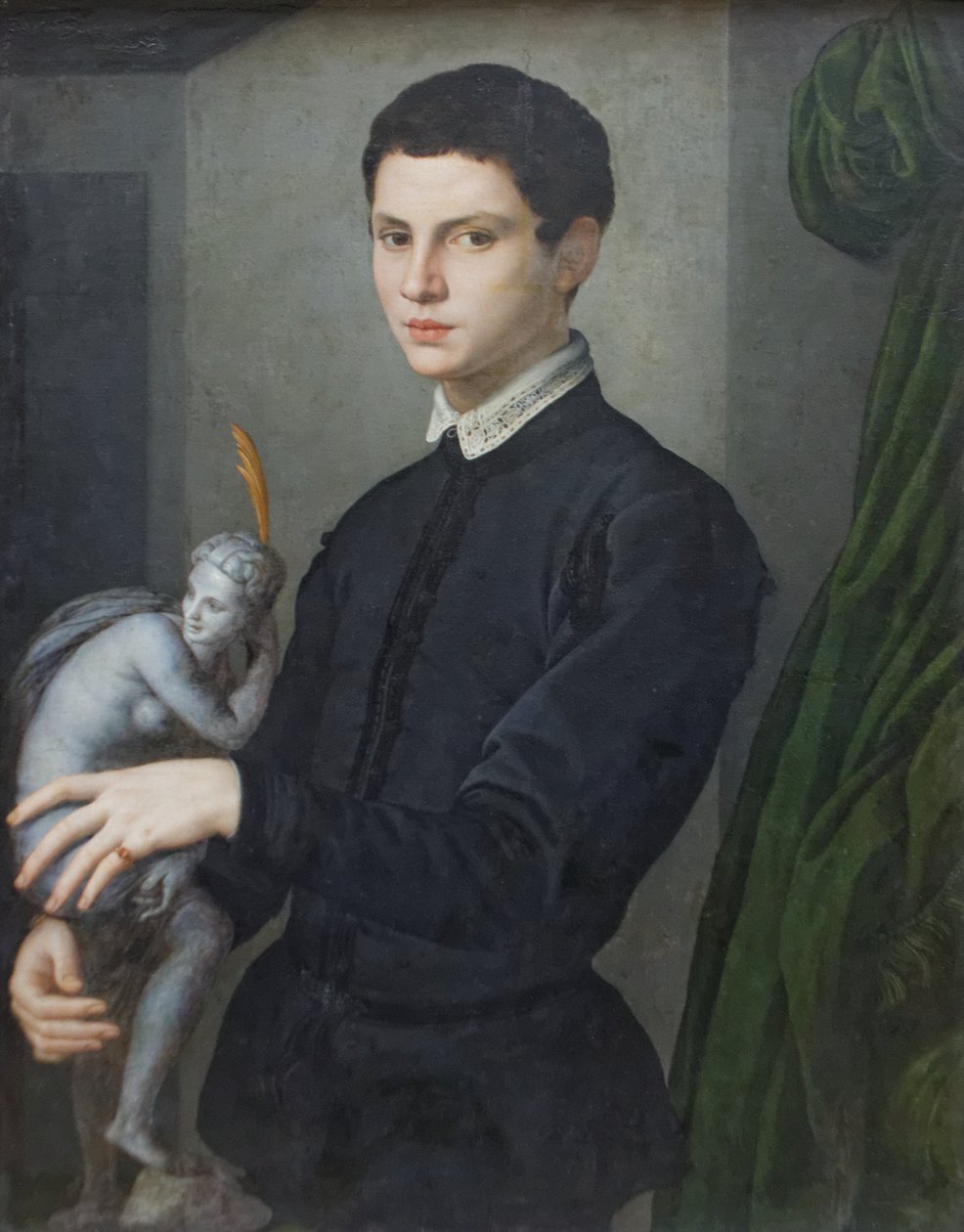 Egy szobor, kezében egy ember portréja alkotó: Agnolo Bronzino