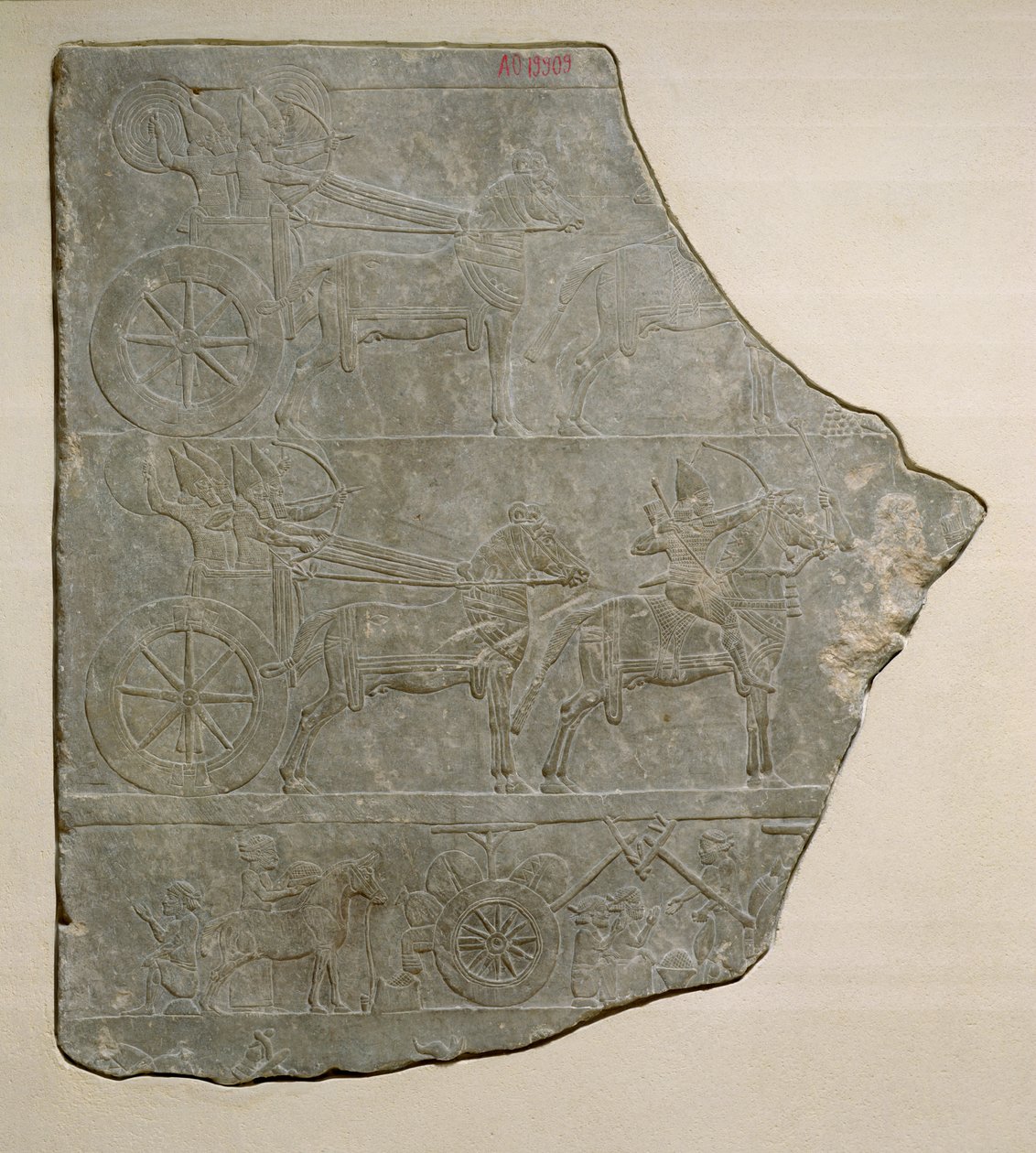 Az asszír hadsereget csatában és nyugalomban ábrázoló domborműtöredéke a ninivei Ashurbanipal palotából alkotó: Assyrian