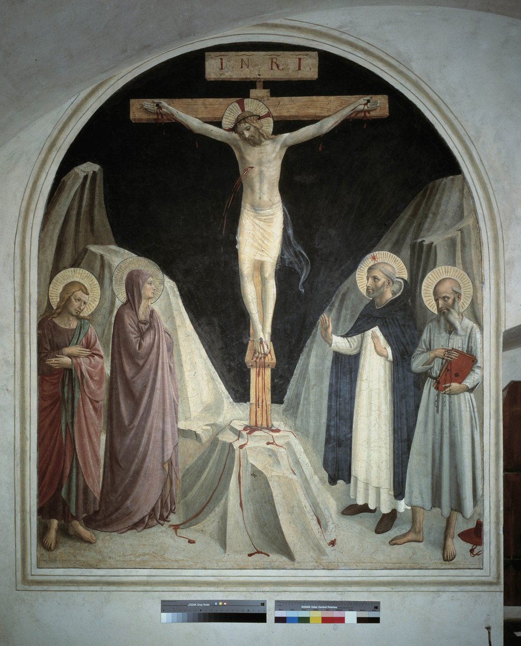 Krisztus keresztre feszítése Szűz Máriával, Szent János evangélistával, Szent Jeromossal, Szent Domonkossal. "INRI" felirat a kereszten. Guido di Pietro freskója alkotó: Fra Angelico