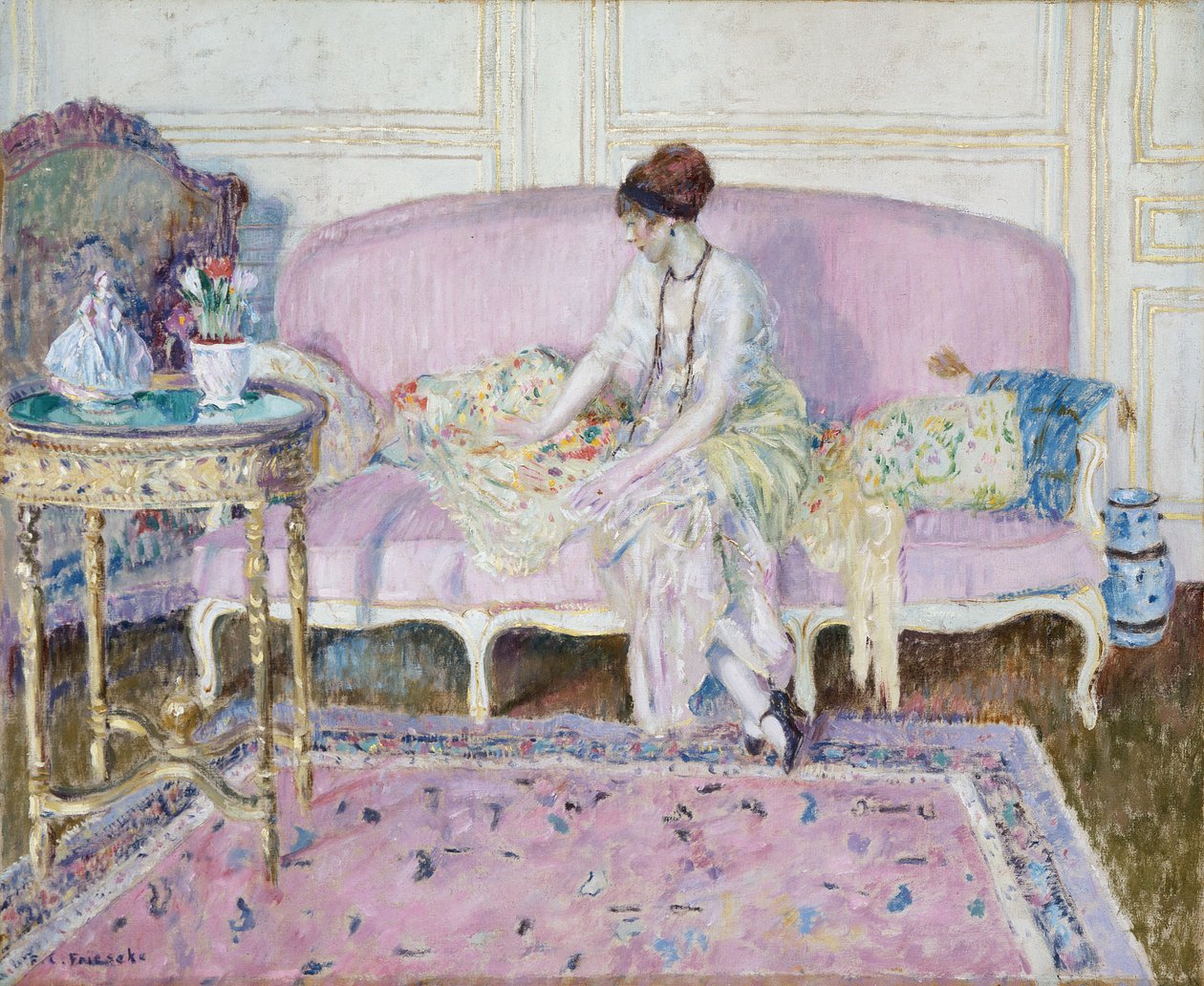 Nő ül a kanapén a belső térben alkotó: Frederick Carl Frieseke