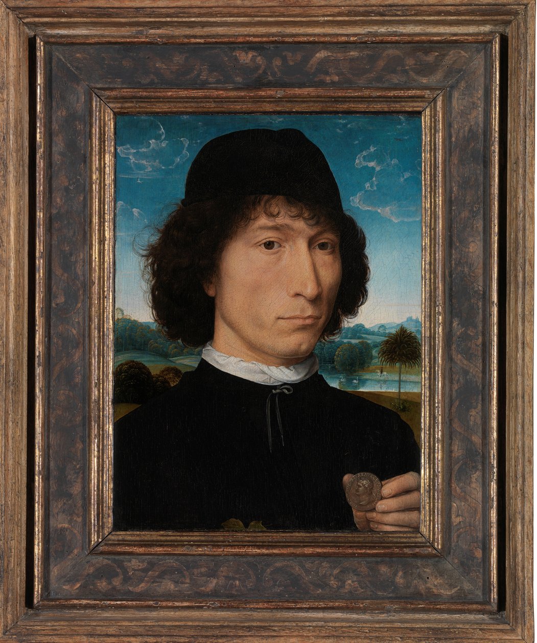 Római éremmel rendelkező férfi portréja alkotó: Hans Memling