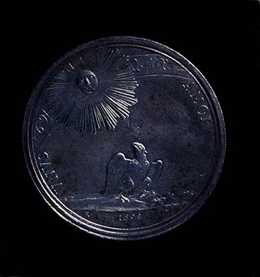 A mantovai Anna Izabella portréérme hátlapja, amely a napot figyelő sast ábrázol, 1698-ban verték. Felirat: (ezüst) (az előlapot lásd 119199) alkotó: Italian School