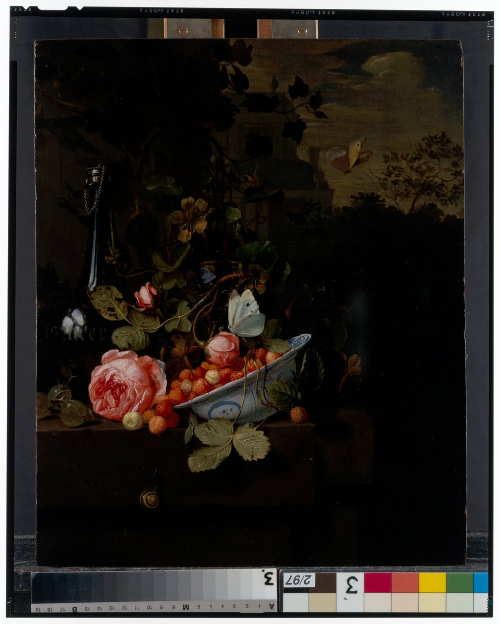 Still Life with a bowl of strawberries, a rose and a bottle on a ledge, a landscape beyond alkotó: Jan Mortel