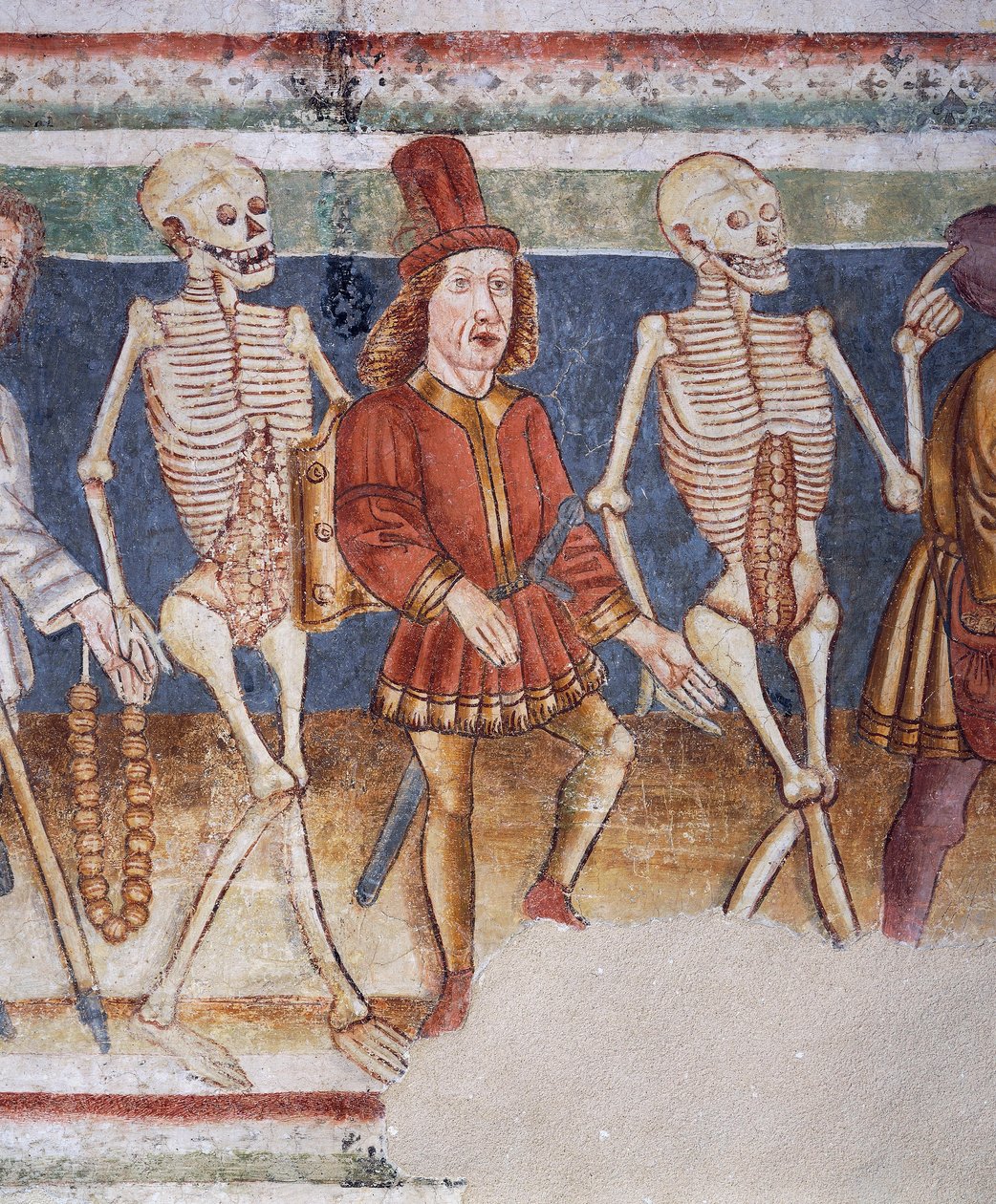 Hrastovlje erődtemplom, Szentháromság-templom, Halál kísérő kereskedő és gazdag bankár, Haláltánc (1490), részlet Janez Iz Kastva, Szlovénia freskóiból alkotó: Janez Kastav
