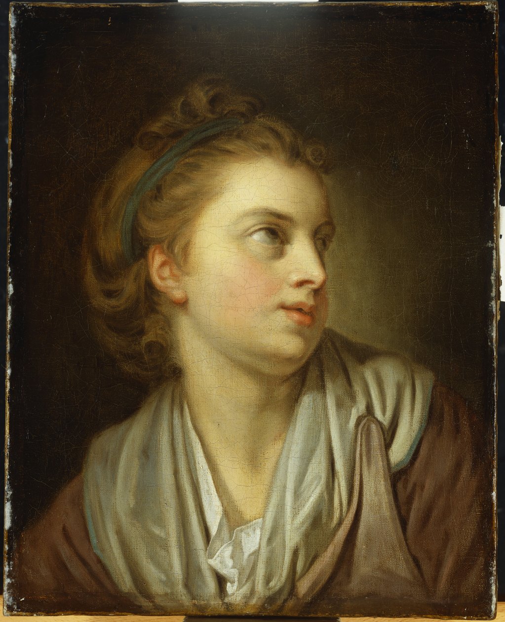 Egy lány, mellhosszú, zöld hajpánttal, felfelé néz alkotó: Jean Baptiste Greuze