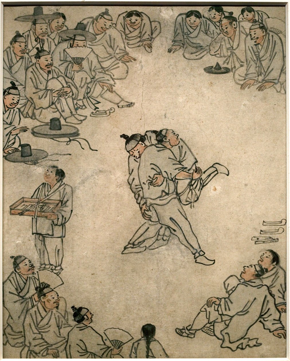 Hagyományos birkózás színtere nézőkkel és édességárussal. Danwon (Kim Hongdo) festménye (1745-1806), tus papírra, Coreen művészet, Joseon (Choson) 18. századi időszak. Koreai Nemzeti Múzeum, Szöul (Dél-Korea). alkotó: Kim Hong Do