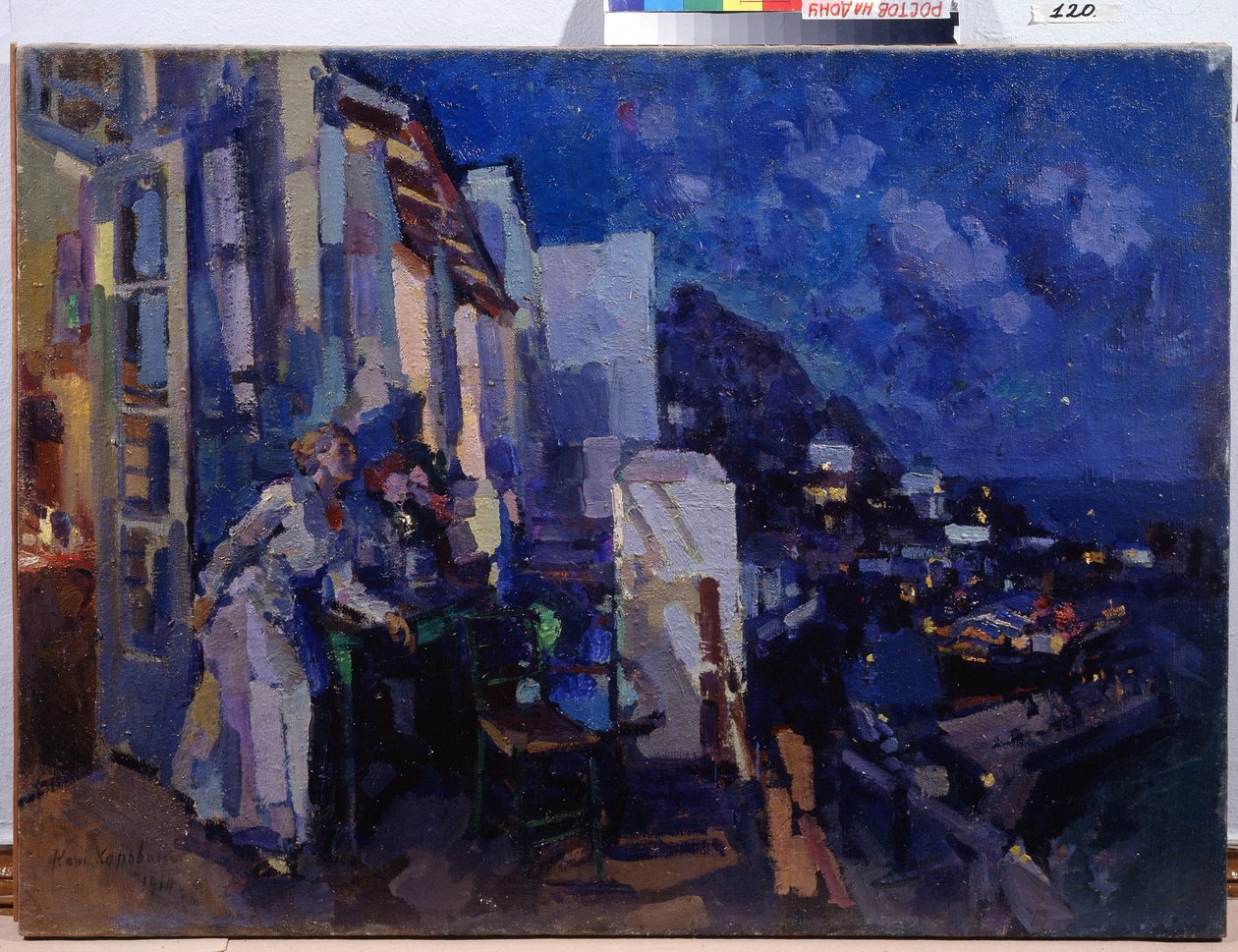Este a verandán. Egy nő kihasználja a város panorámáját, amely az éjszakába nyúlik a terasza előtt. Konsztantyin Alekszejevics Korovin (Konsztantin Korovin) festménye (1861-1939), olaj, vászon alkotó: Konstantin Alekseevich Korovin