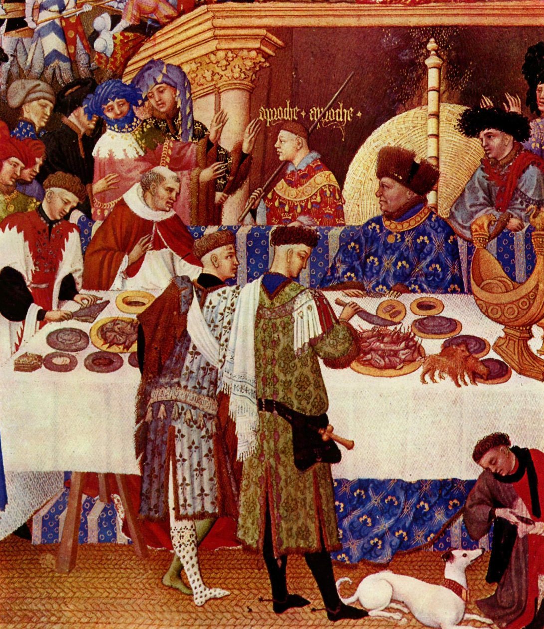 A jobbra lent ülő, a tűznek háttal ülő Duc de Berry kék ruhát és szőrme sapkát visel. Felkéri családját és barátait, hogy mutatkozzanak be neki. Mögötte a felirat: "Közeledj közeledj". A herceg több barátja és családtagja közeledik hozzá. alkotó: Limbourg Brothers