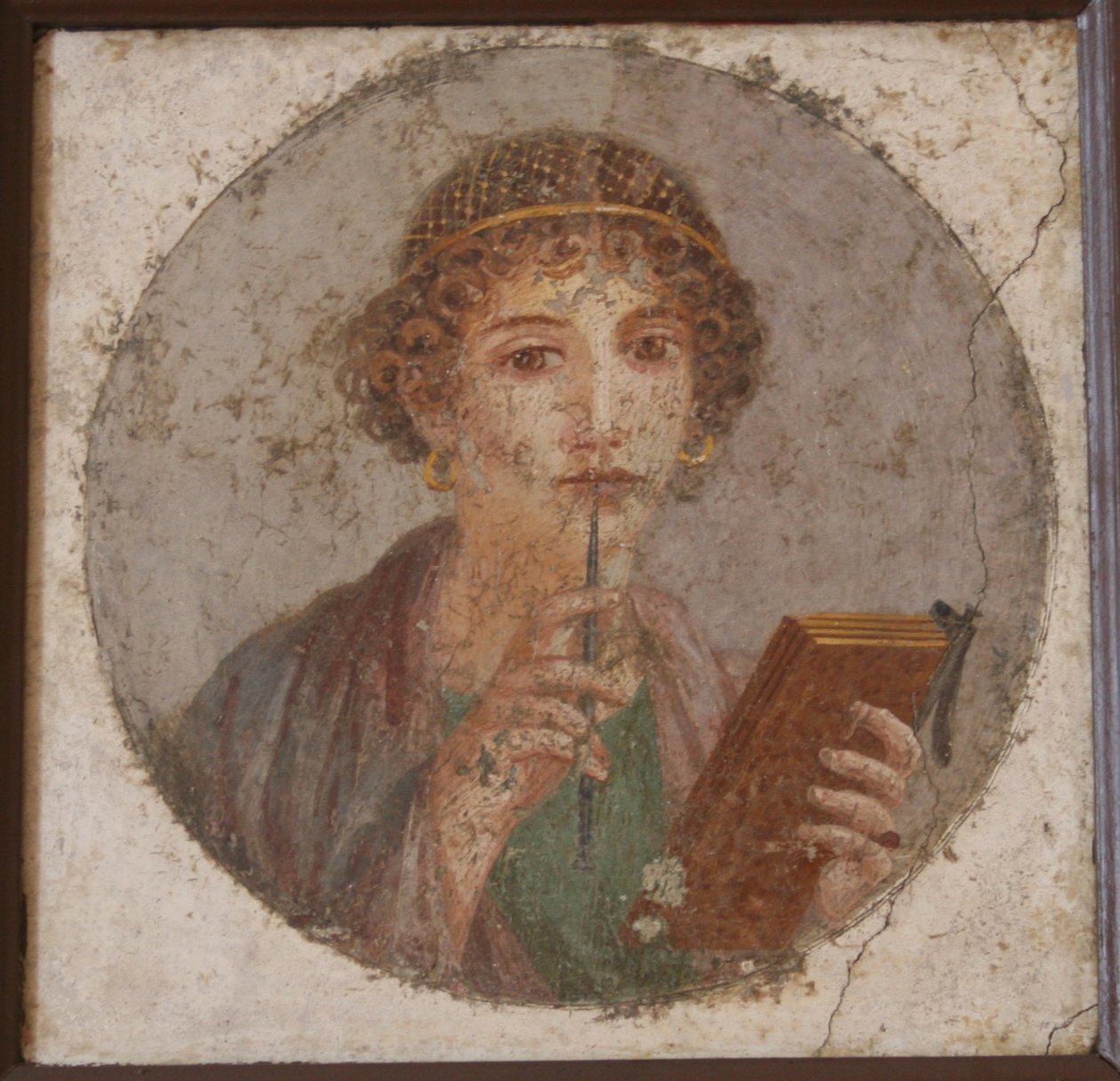 Egy fiatal nő könyvvel és ceruzával Úgynevezett Sappho, kb. 50 éves alkotó: Master of Herculaneum