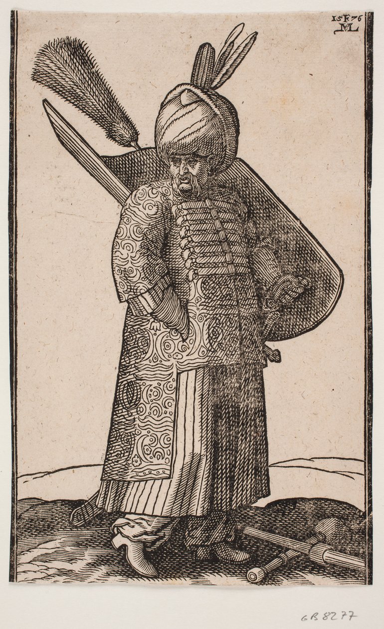 Vastag hasú katona áll, r.-kézzel zsebben, arccal r.-vel; két toll a turbánban; v. oldalkarddal, v. karpajzson tollbokrossal; előtte a földön hadiütő és lándzsa a kereszt felett alkotó: Melchior Lorck