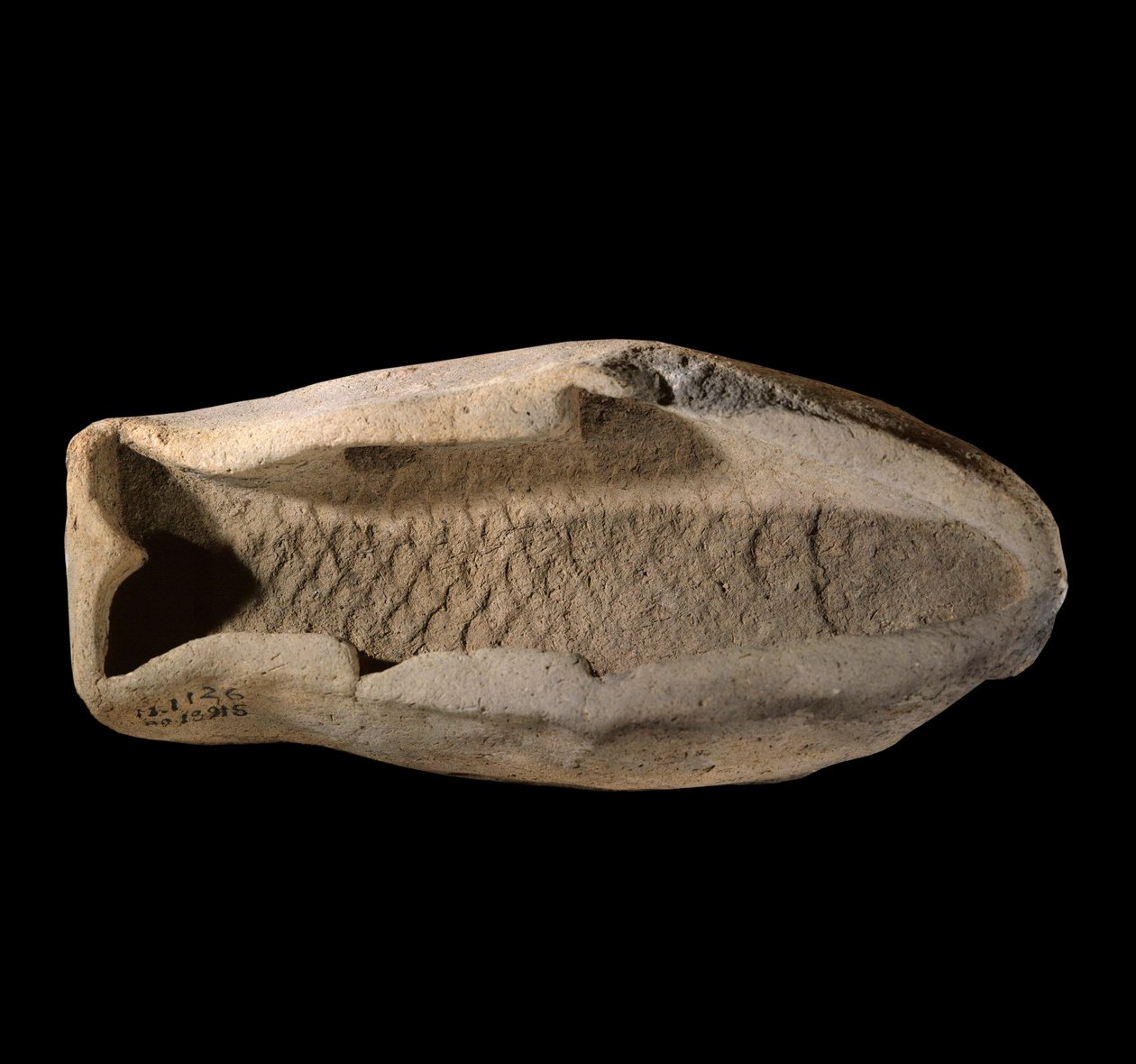 Mezopotámia: hal alakú terrakotta penészgomba. Kr.e. 1800 körül. A Marinál Zimri Lim király palotájának királyi ételeiből. Párizs, Louvre Múzeum alkotó: Mesopotamian