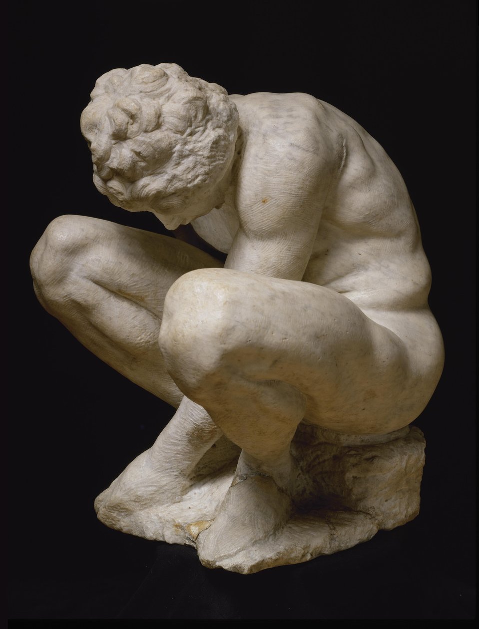 Guggoló fiú, 1530 és 1534 között. alkotó: Michelangelo Buonarroti