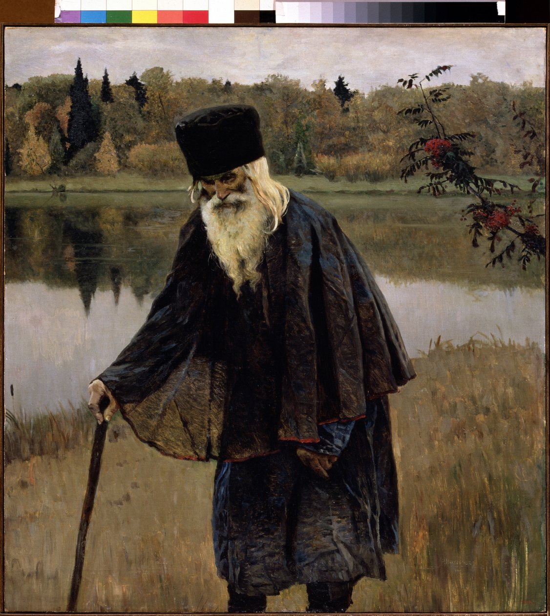 Egy remete (A Remete). Egy szakállas, fehér hajú öregember sétál a botja fölé hajolva a tó partján. Mihail Vasziljevics Neszterov (1862-1942) festménye, olaj, vászon alkotó: Mikhail Vasilievich Nesterov