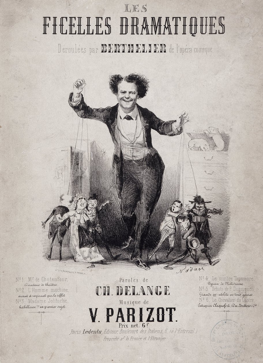 Jean Berthelier (1830-1888) portréja, aki a bábok fiait tartja kezében. Album „Les Ficelles Dramatiques, amelyet Berthelier de l’opera comique bontott ki” alkotó: Nadar