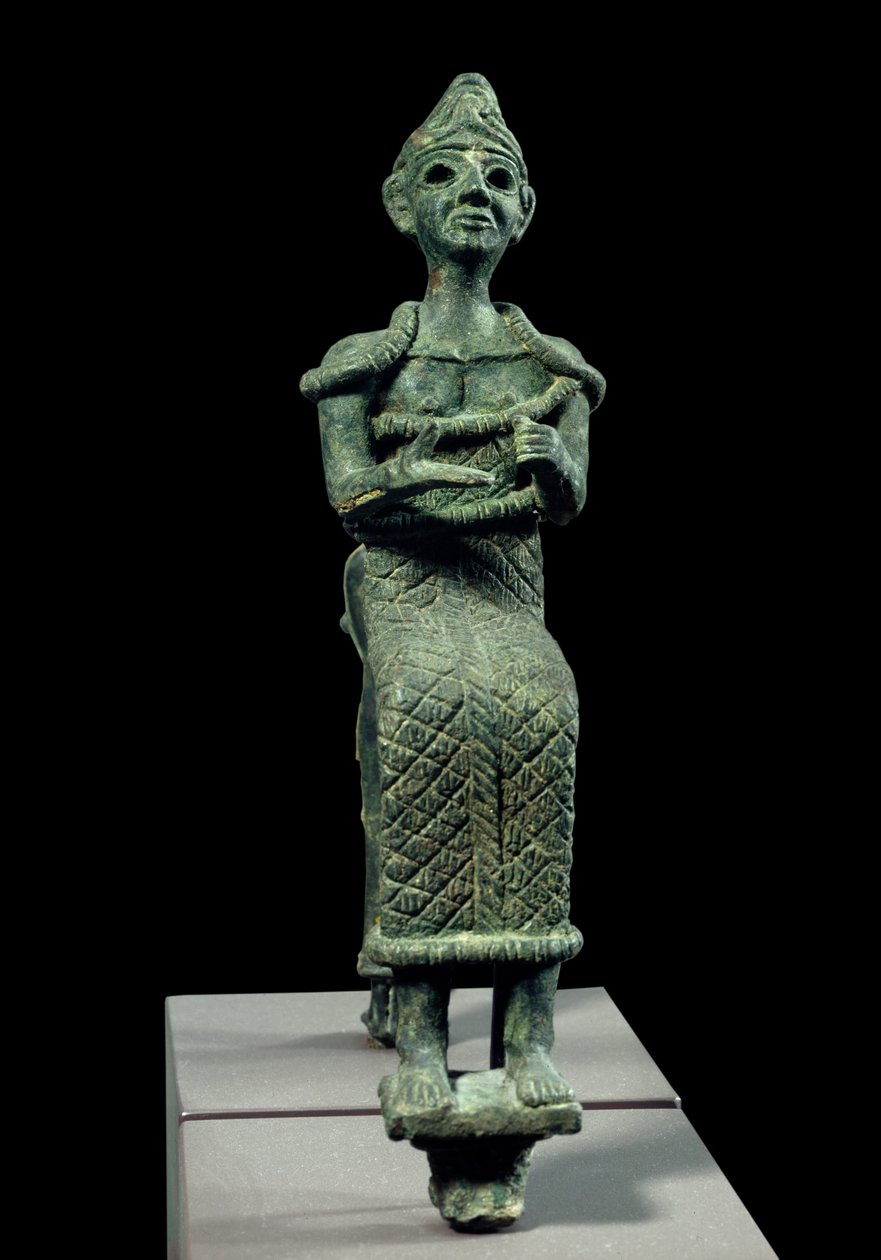 Az ókor keleti művészete: egy ülő istennő szobra. Bronz szobor. Fönícia szobra, Kr.e. 1300 körül. Párizs, Musee du Louvre alkotó: Phoenician