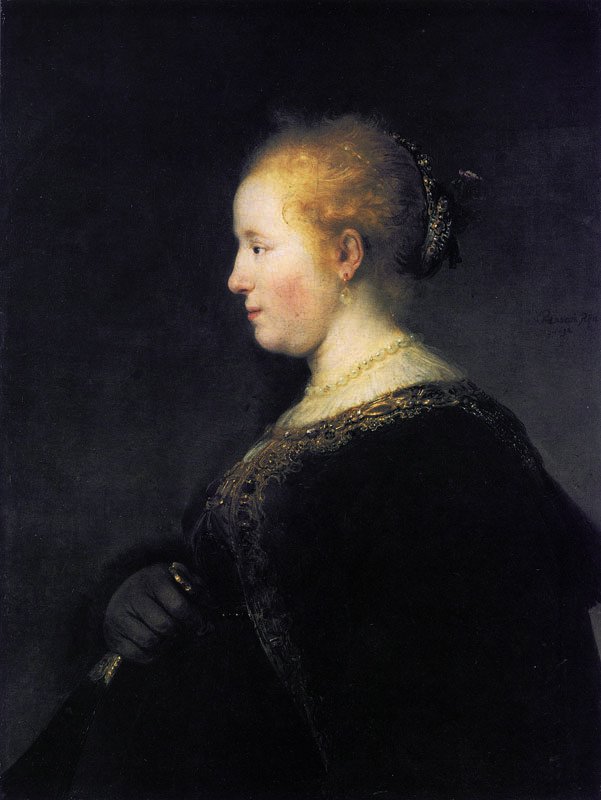Egy fiatal nő profilban, rajongóval alkotó: Rembrandt van Rijn