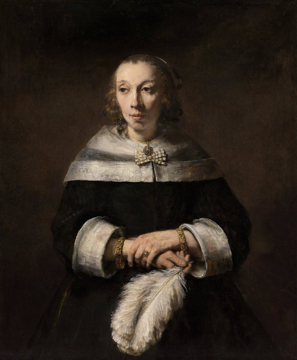 Egy strucc-toll rajongóval rendelkező hölgy portréja alkotó: Rembrandt van Rijn
