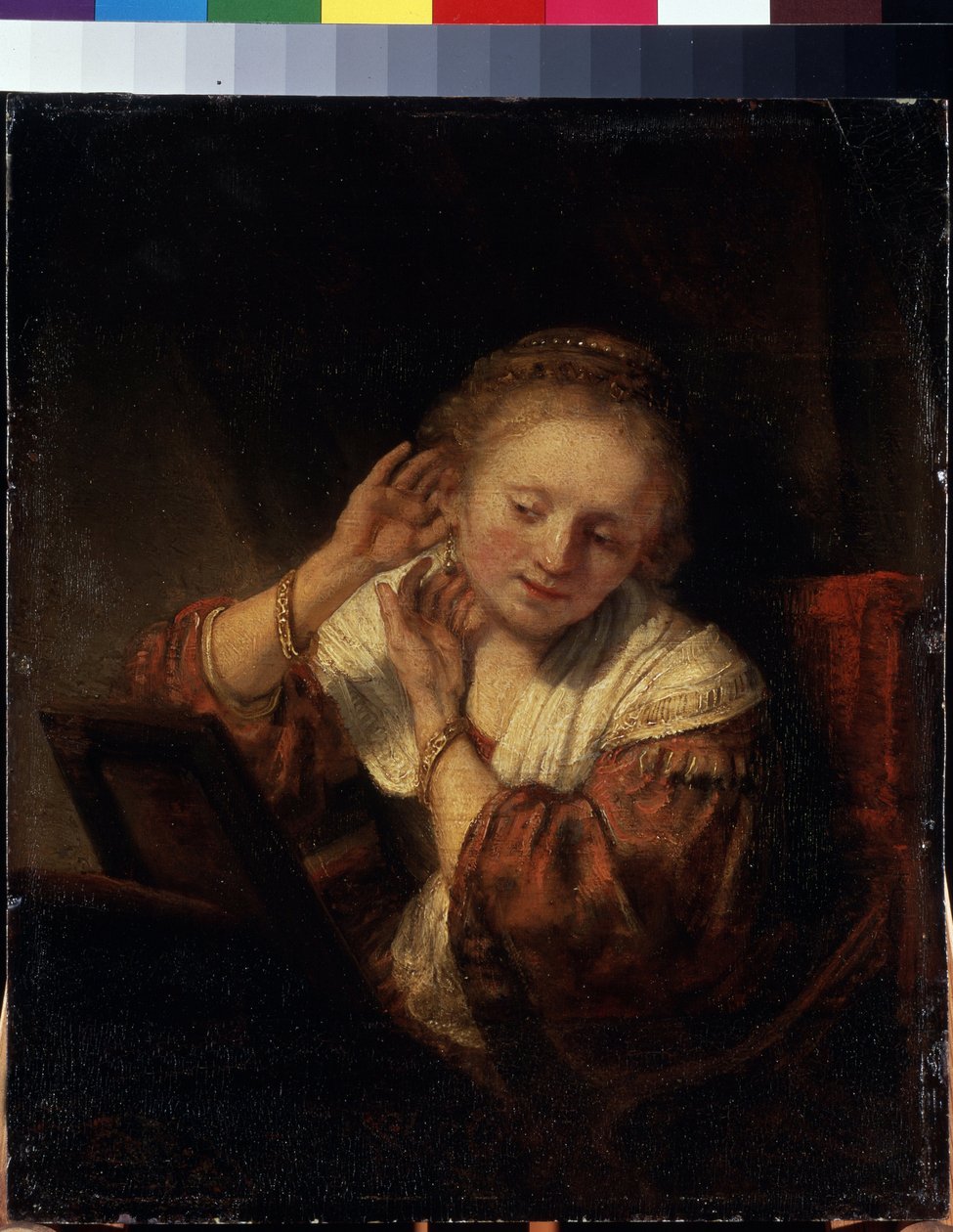 Fiatal nő próbálja fel a fülbevalót. Fiatal nő próbálja fel a fülbevalót. Harmenszoon van Rijn, Rembrandt festménye (1606-1669) alkotó: Rembrandt Harmensz. van Rijn