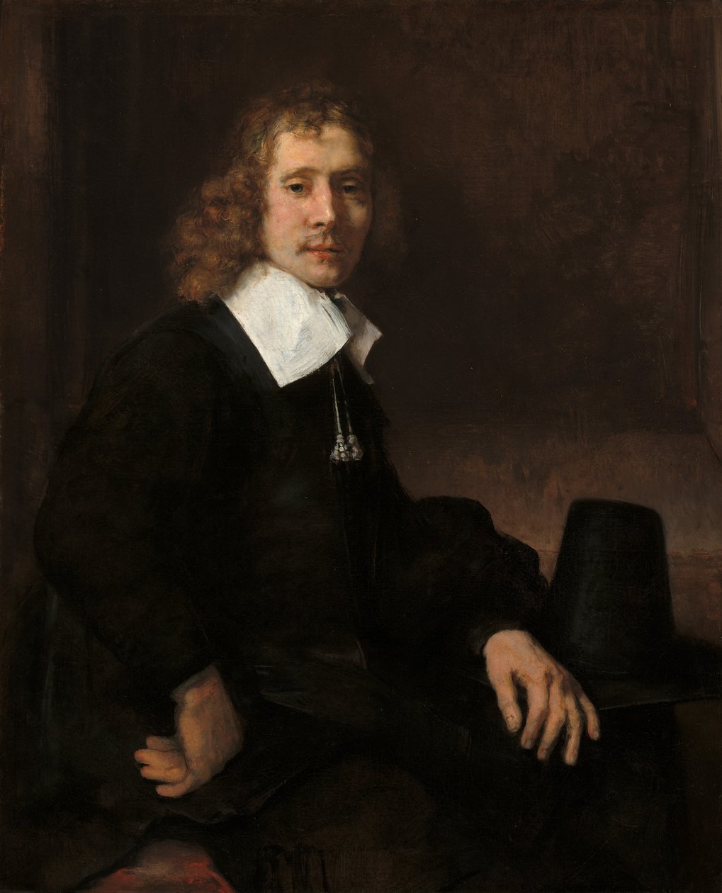Egy fiatal férfi egy asztalnál ül, valószínűleg Govaert Flinck, c. 1660. alkotó: Rembrandt van Rijn