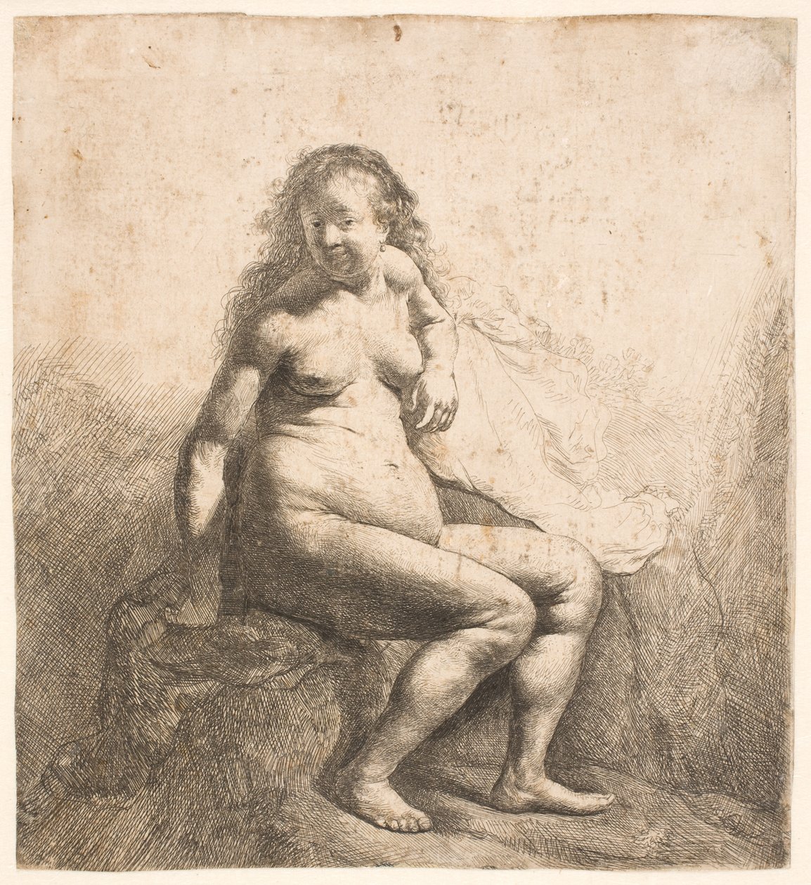 Egy dombon ülő meztelen nő alkotó: Rembrandt van Rijn