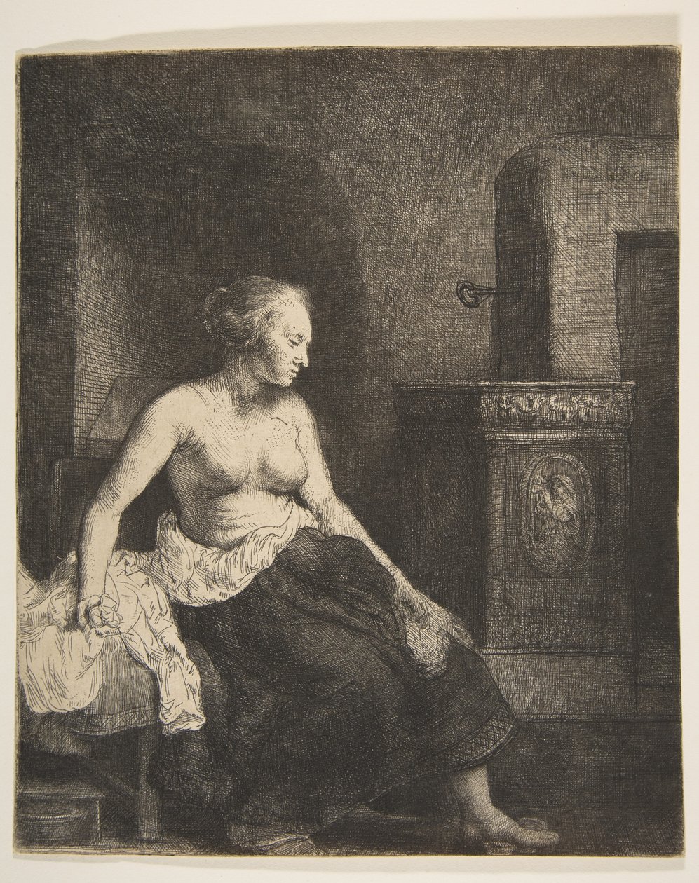 A tűzhely mellett félig öltözött nő ül, 1658. alkotó: Rembrandt van Rijn