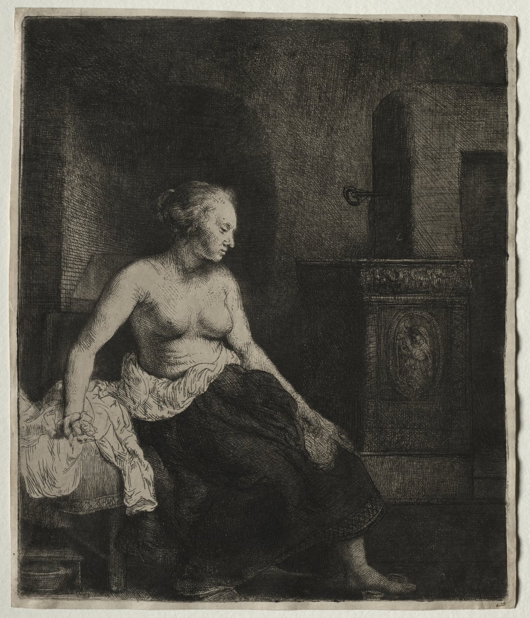 Nő félig felöltözve ül a tűzhely mellett alkotó: Rembrandt van Rijn
