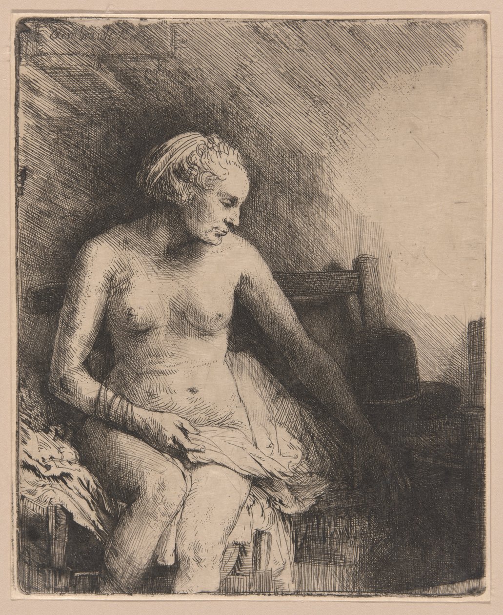 Nő a fürdőben kalappal mellette alkotó: Rembrandt van Rijn