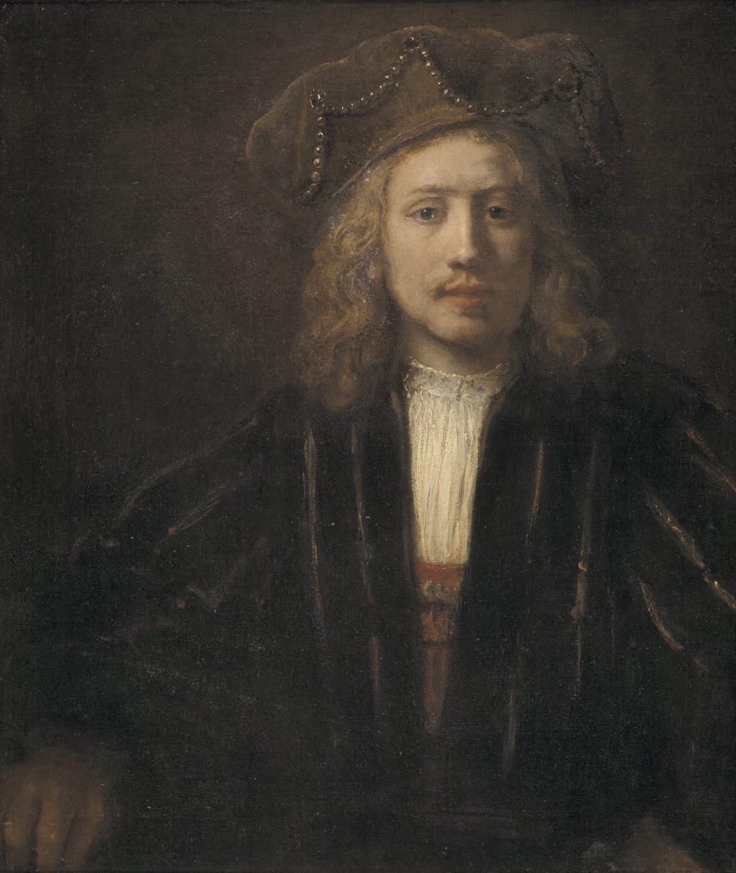 Fiatal férfi gyöngysoros sapkában alkotó: Rembrandt van Rijn