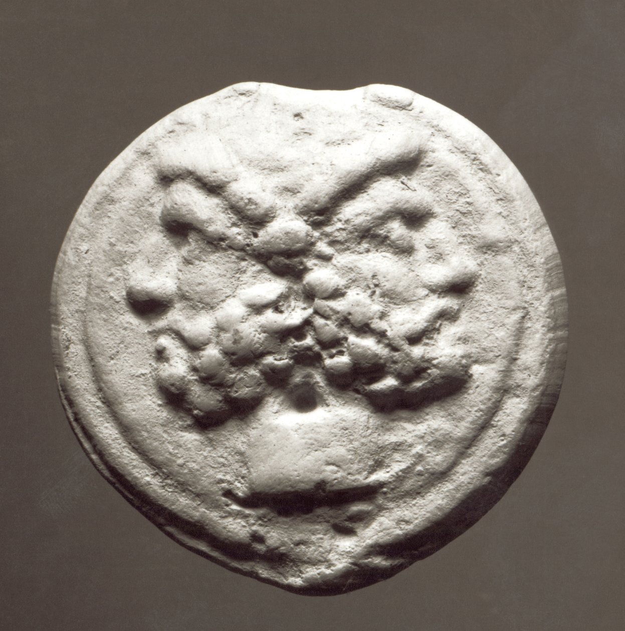 Janus istent ábrázoló érme, ie 753-476 (fém) alkotó: Roman