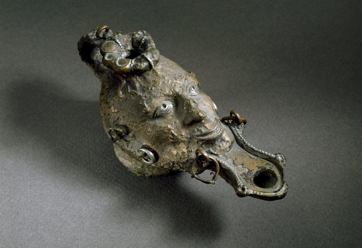 Római művészet: arc alakú bronz olajlámpa. 1. vagy 2. században. Spanyolország Museo di Ampurias (Empurias) alkotó: Roman