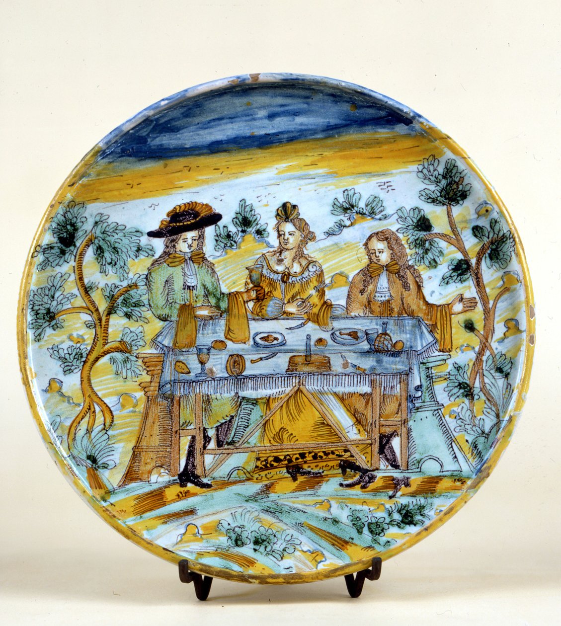 Egy szabadtéri bankett ábrázolása a talavera de la reina (Spanyolország) kerámia tányérján. 16. század eleje. Milánó, Museo del Castello. alkotó: Spanish School