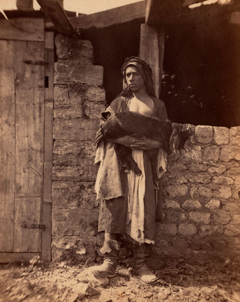 Libanoni Patre egy gyerekkel. Charles Lallemand (1826-1904) fotográfiája a "Szíria, jelmezek, utazások és tájak" című kötetben. 1865. Magángyűjtemény. alkotó: Unbekannter Künstler