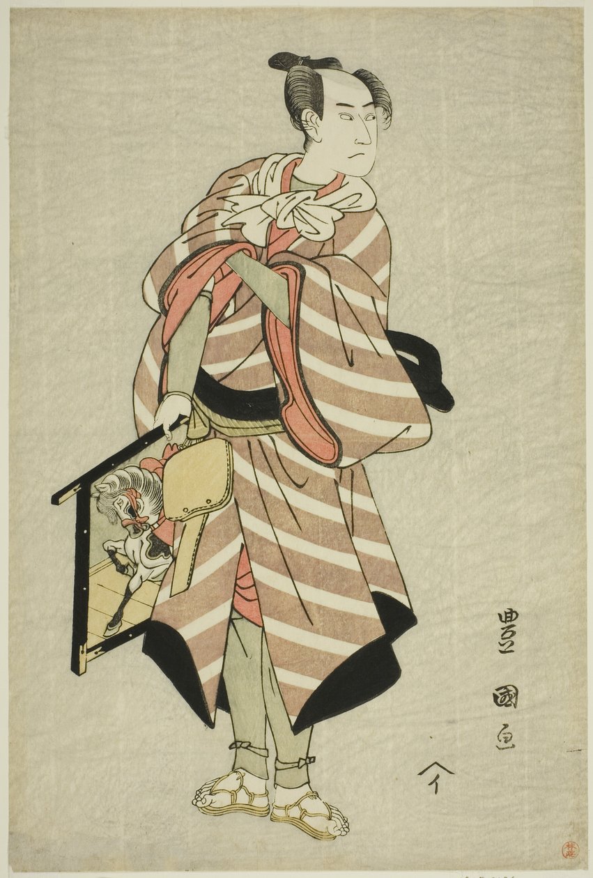 A színész, Sawamura Sojuro III, mint a teherhordó, Muchizo a "Miyamairi Musubi no Kamigaki" című darabban, amelyet a Kiri Színházban mutattak be 1797. tizenegyedik hónapjában. alkotó: Utagawa Toyokuni I