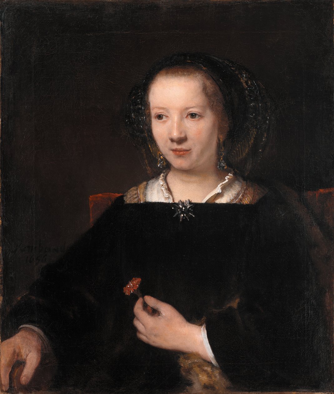 Fiatal nő egy szegfűvel alkotó: Workshop of Rembrandt van Rijn
