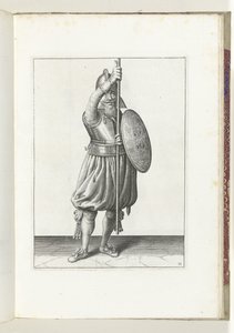 A gyakorlat pajzzsal és lándzsával: a katona háromszor visszateszi a lándzsát nyugalmi helyzetbe, második mozdulat (11. sz.), 1618 A Nassausche Wapen-Handelinge, van Schilt, Kémek, Rappier és a célpont: Beyde Figuerlick ábrázolva, a bekeretezett pedig a alkotó: Adam van Breen