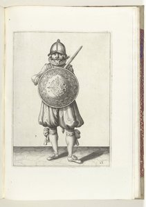 A gyakorlat pajzzsal és lándzsával: a nyugalomban álló katona karját a bal vállára támasztja a pajzs mögött (23. sz.), 1618 A Nassausche Wapen-Handelinge, van Schilt, Kémek, Rappier ende Targe : a figura ábrázolja, az ende az n után pózolva alkotó: Adam van Breen