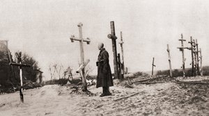 Orosz katona egy harcostársa sírjánál az első világháború alatt, a The Illustrated War News-ból, 1915 alkotó: English Photographer