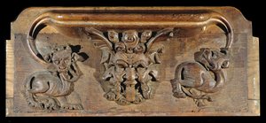Egy nyomorúság, amely három emberi arcot ábrázol szörnyekkel körülvéve, New College Chapel, Oxford, 14. század vége (fa)