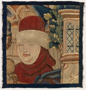 Small fragment of tapestry depicting the head of a man, late 15th century (wool)