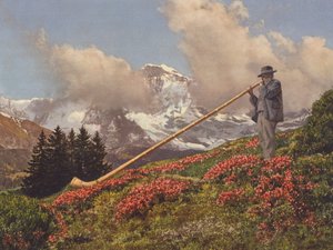 Svájc: Alphorn Blower, a Jungfrau a háttérben (színes fotó)