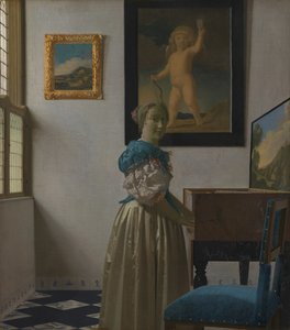 Eine junge Frau an einem Virginal