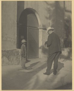 Szegény gyermeket fényképező férfi alkotó: Louis Fleckenstein
