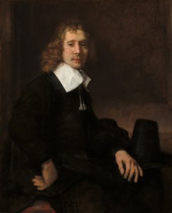 Egy fiatal férfi egy asztalnál ül (esetleg Govaert Flinck) alkotó: Rembrandt van Rijn