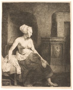 Nő félig felöltözve ül a tűzhely mellett alkotó: Rembrandt van Rijn