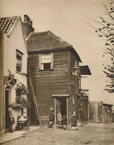 Régi házak Highgate-ben, amelynek bejárataiból a falusiak az autóbuszokat nézték, 1935. alkotó: Unbekannt