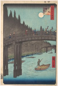 Telihold egy csatorna felett, híddal és hatalmas bambuszhalmokkal a part mentén alkotó: Utagawa Hiroshige