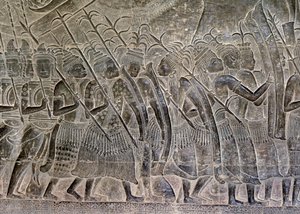 Angkor Wat, Angkor, Kambodzsa 12. század eleje, későbbi kiegészítésekkel. A galéria domborműveinek ezen részlete a khmer hadsereg szövetségeseként felvonuló thai népet mutatja