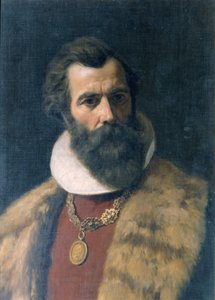 Szakállas férfi prémes gallérral és lánccal