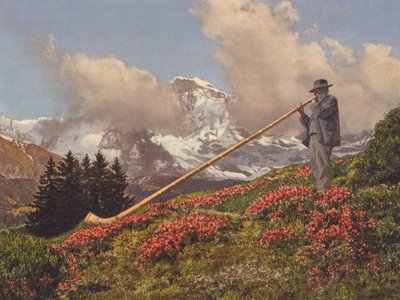 Svájc: Alphorn Blower, a Jungfrau a háttérben (színes fotó) alkotó: Jean Gaberell